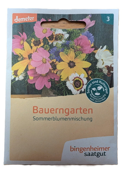 KI generiert: Saatgutpackung mit bunten Blumen. Text: "Bauerngarten Sommerblumenmischung, bingenheimer saatgut".